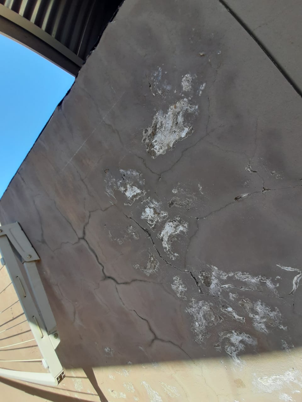 Wall showing efflorescence and water damage